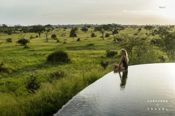 Singita Grumeti_Wellness_Guest meditating at edge of pool_webp